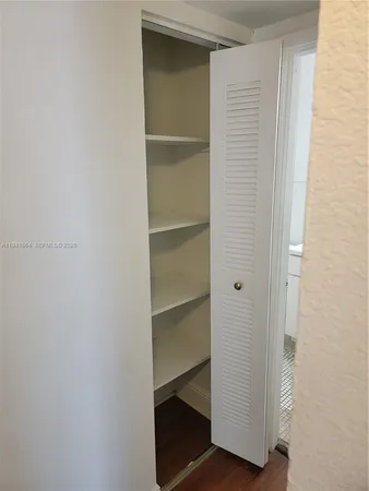 a view of an empty walk in closet