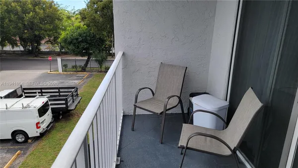 a view of swimming pool from a balcony