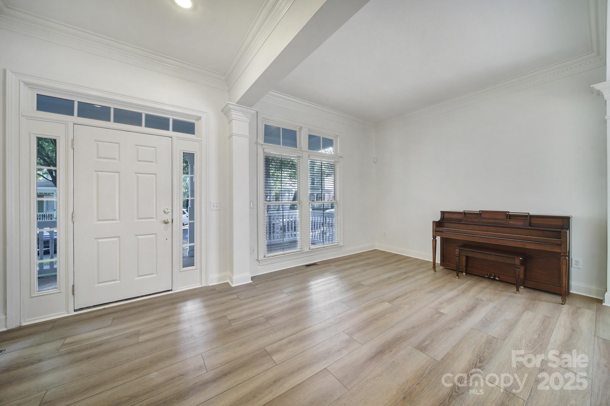 2612 Nations Commons Street Fort Mill, SC 29708 - Photo 8 of 48 a view of empty room with wooden floor and windows