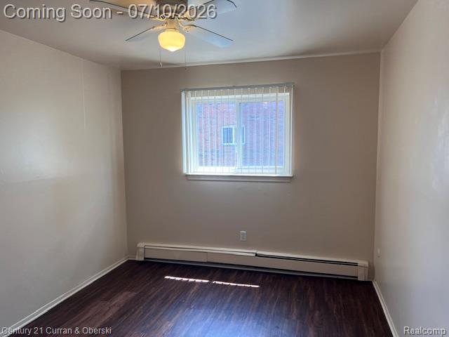 14682 Middle Gibraltar Road, Unit 24 Rockwood, MI 48173 - Photo 19 of 21 Interior room featuring wood-finish flooring, light-toned walls, and a window with blinds