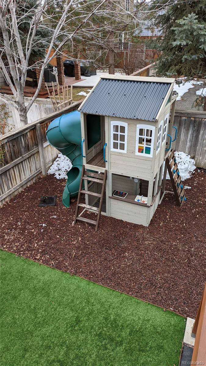 2373 Hyacinth Road Highlands Ranch, CO 80129 - Photo 27 of 38 a view of a house with a yard and sitting area