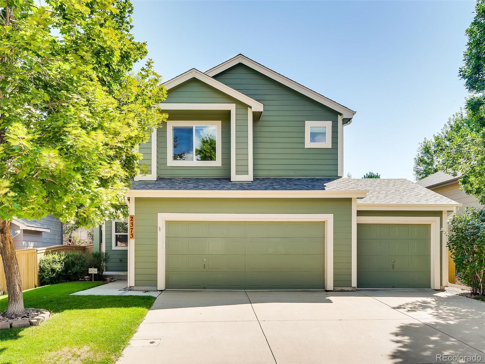 2373 Hyacinth Road Highlands Ranch, CO 80129 - Photo 29 of 38 a front view of a house with a garage
