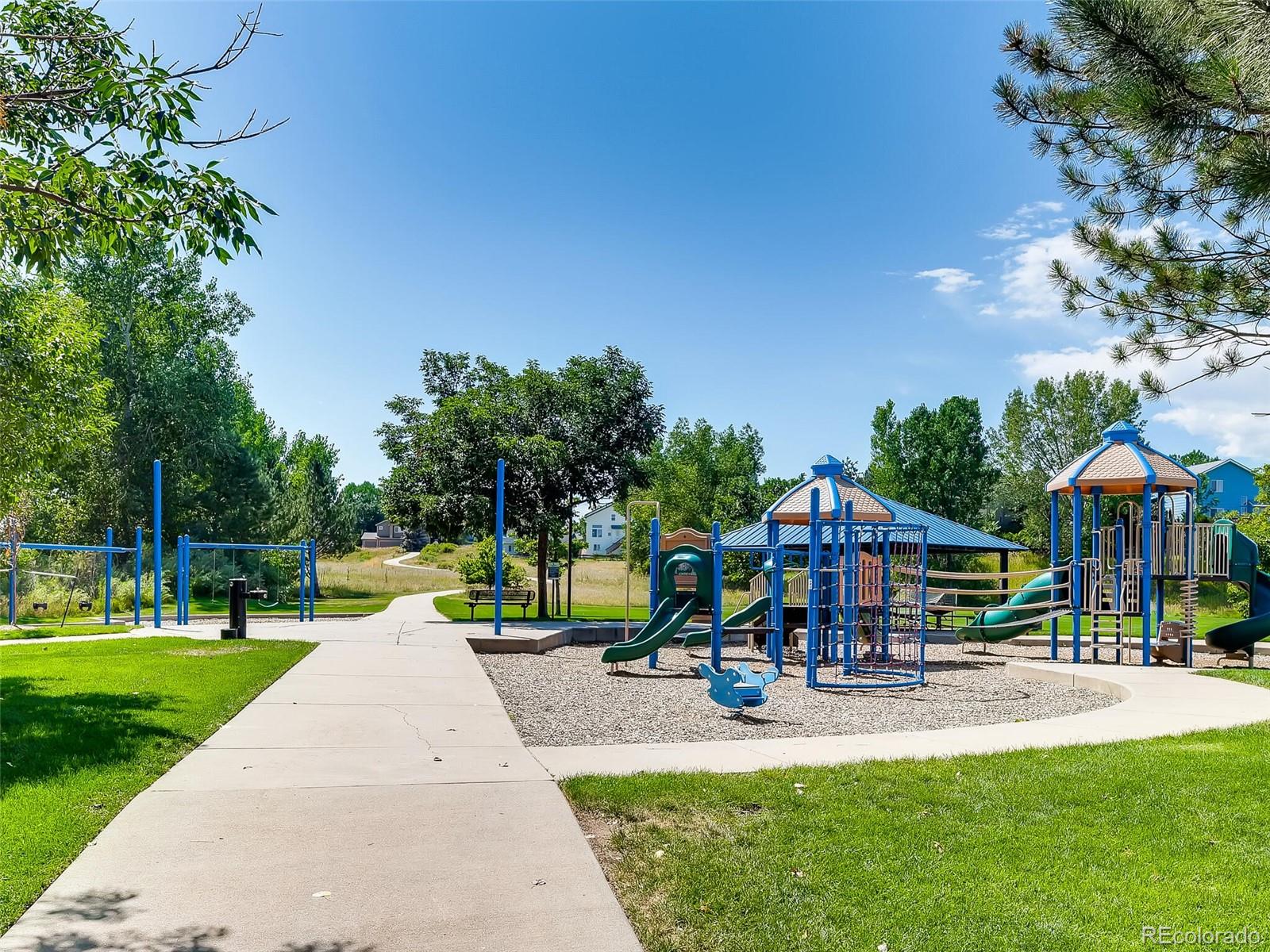 2373 Hyacinth Road Highlands Ranch, CO 80129 - Photo 33 of 38 a view of a park with swings and slides