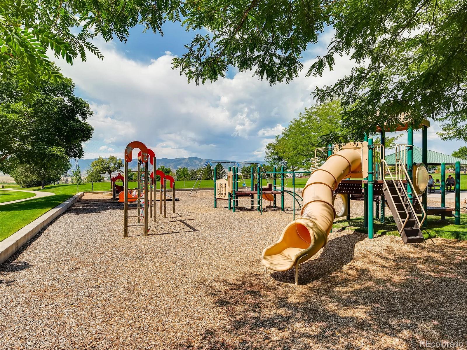2373 Hyacinth Road Highlands Ranch, CO 80129 - Photo 36 of 38 a view of a park with swings and slides