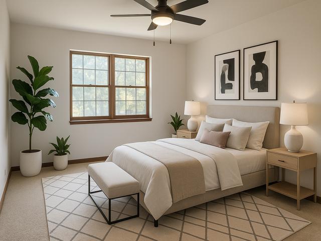 404 St Johns Road, Unit C Woodstock, IL 60098 - Photo 12 of 19 a bedroom with a large bed and potted plant