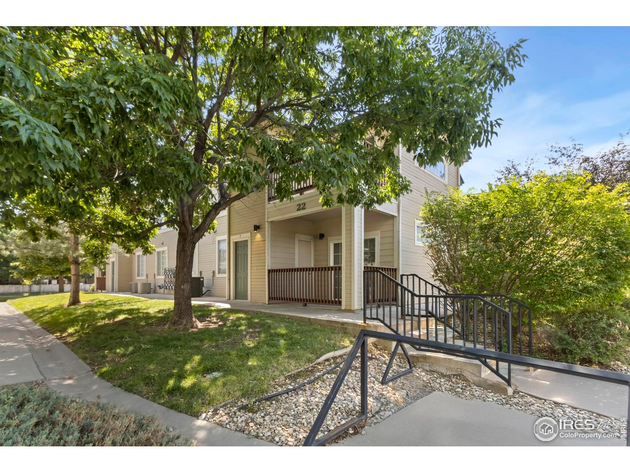 3002 West Elizabeth Street, Unit F Fort Collins, CO 80521 - Photo 16 of 18 a backyard of a house with table and chairs