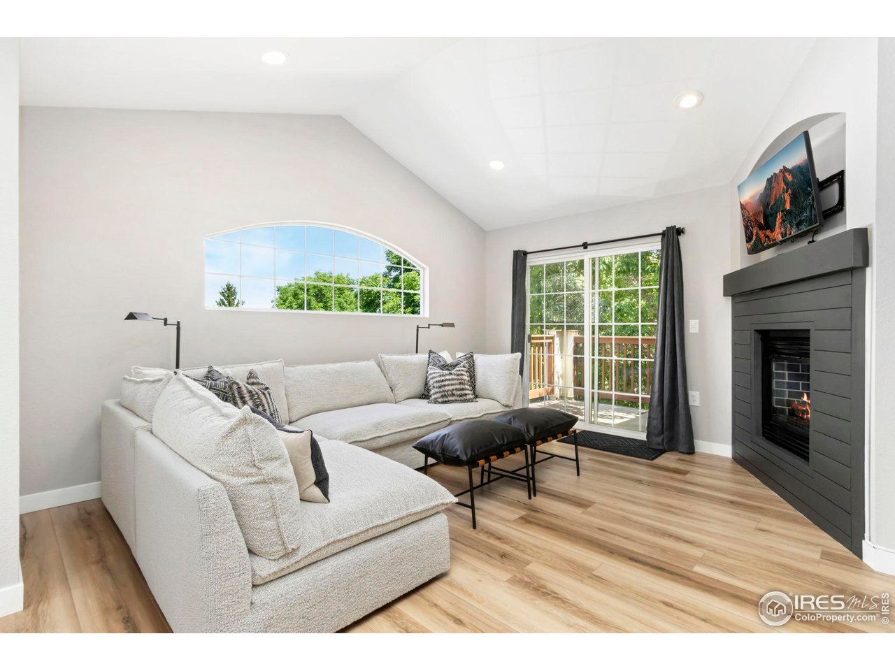 3002 West Elizabeth Street, Unit F Fort Collins, CO 80521 - Photo 5 of 18 a living room with furniture and a fireplace
