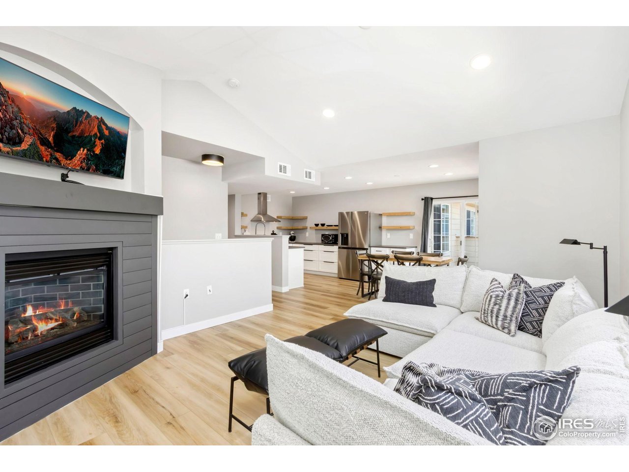 3002 West Elizabeth Street, Unit F Fort Collins, CO 80521 - Photo 6 of 18 a living room with furniture and a fireplace