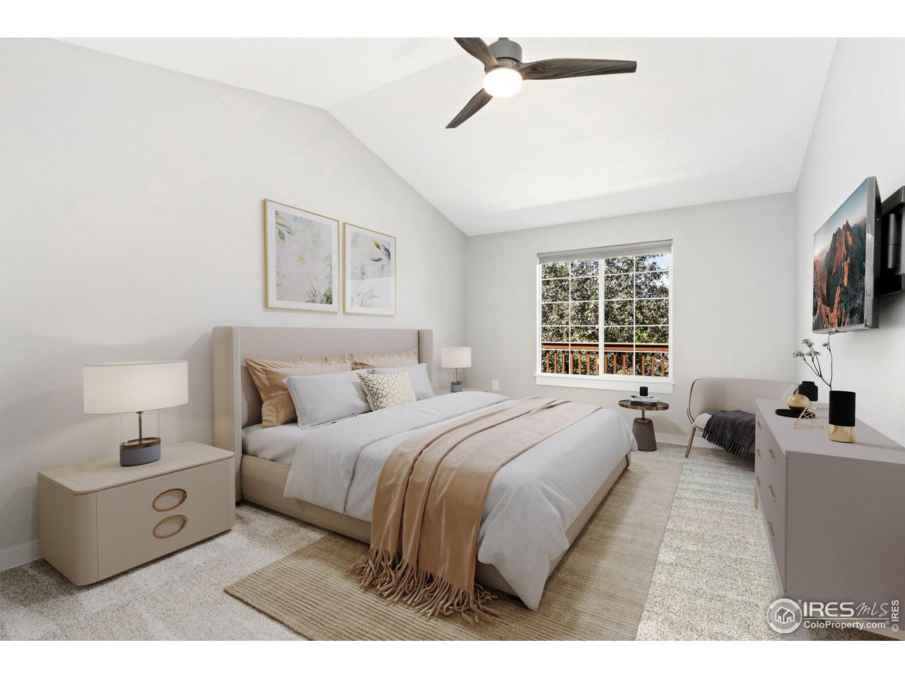 3002 West Elizabeth Street, Unit F Fort Collins, CO 80521 - Photo 8 of 18 a spacious bedroom with a bed a couch and a flat tv screen on the dresser