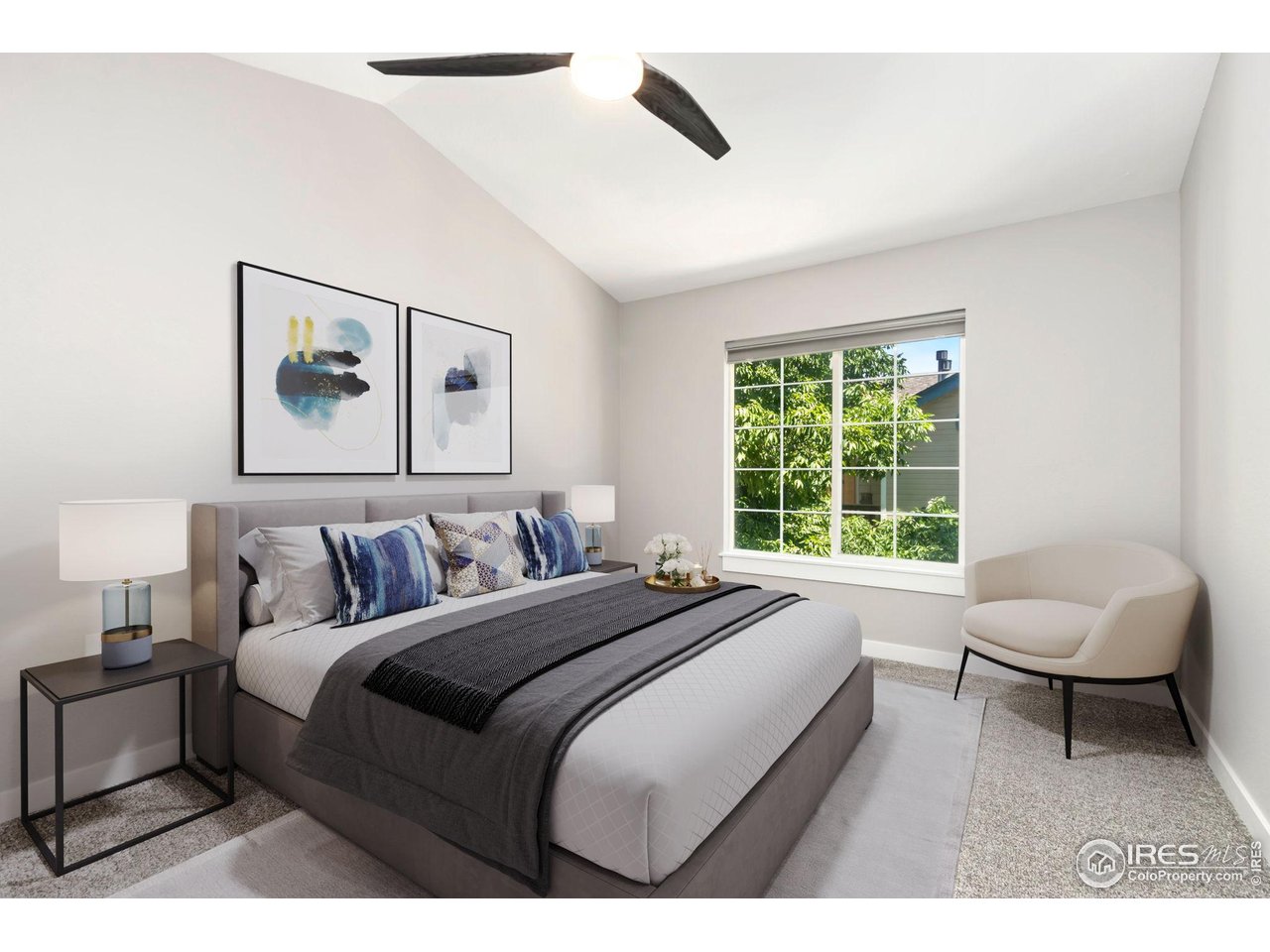 3002 West Elizabeth Street, Unit F Fort Collins, CO 80521 - Photo 9 of 18 a bedroom with a bed and a large window
