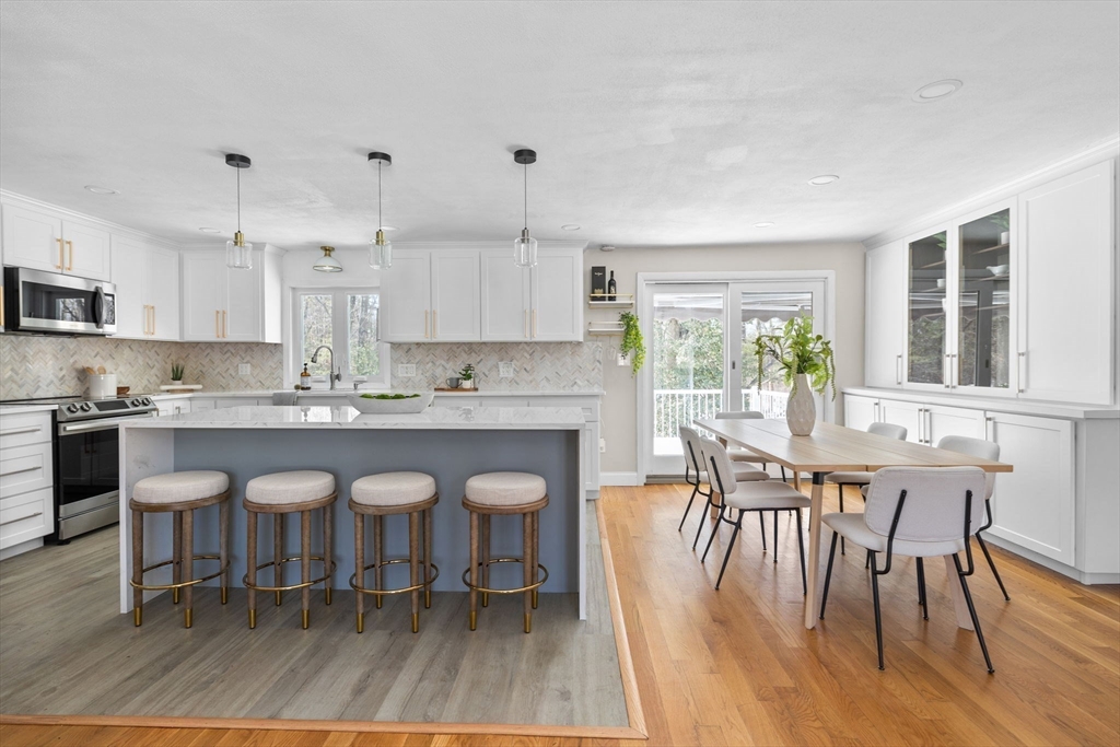 7 Dean Circle Andover, MA 01810 - Photo 25 of 36 a large kitchen with a table and chairs