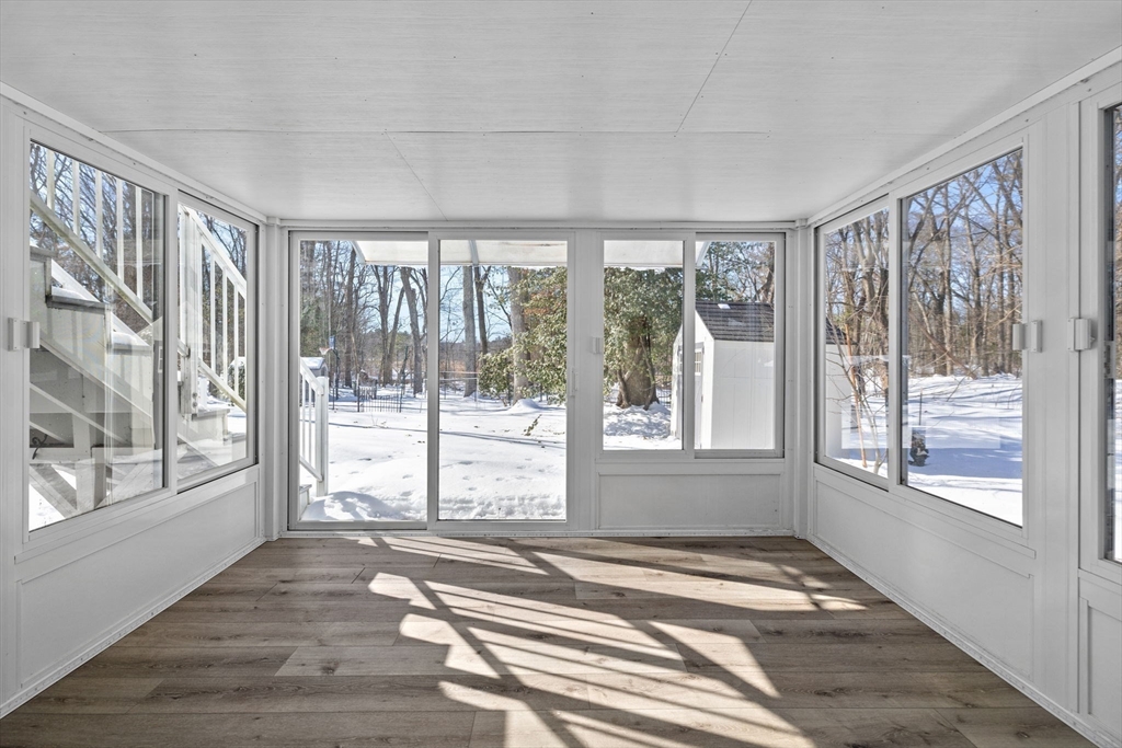 7 Dean Circle Andover, MA 01810 - Photo 29 of 36 a view of empty room with wooden floor and fan