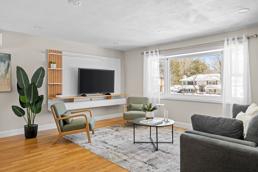 7 Dean Circle Andover, MA 01810 - Photo 3 of 36 a living room with furniture fireplace and a flat screen tv