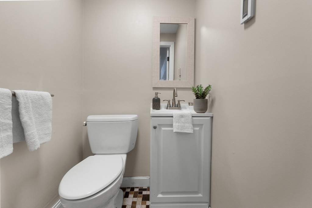 7 Dean Circle Andover, MA 01810 - Photo 32 of 36 a white toilet sitting next to a bathroom sink