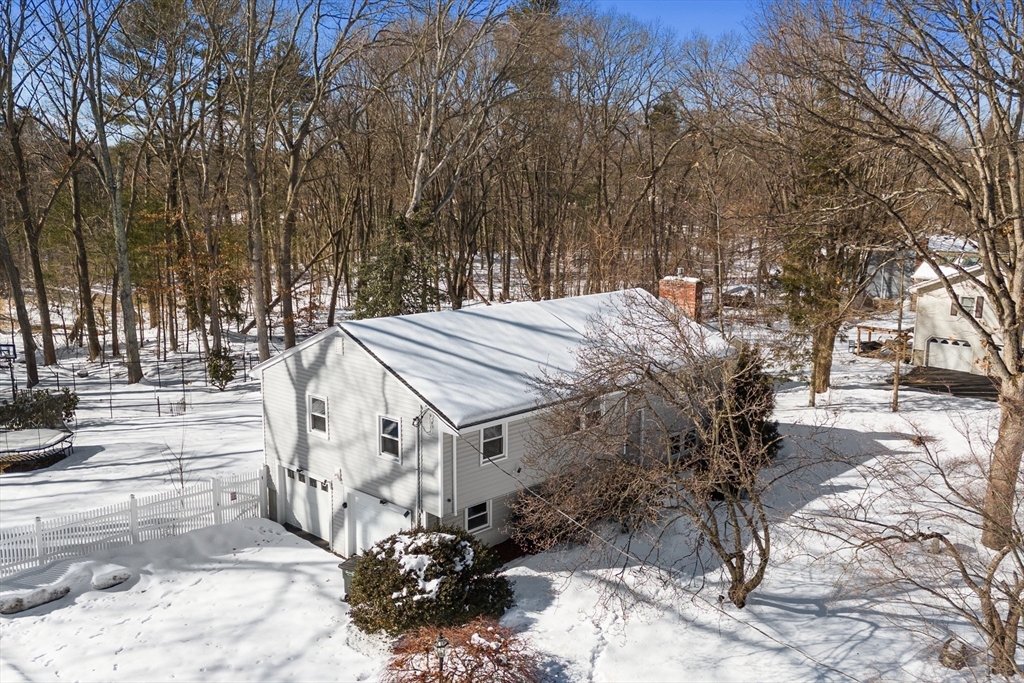 7 Dean Circle Andover, MA 01810 - Photo 35 of 36 a view of a house with a yard covered with snow