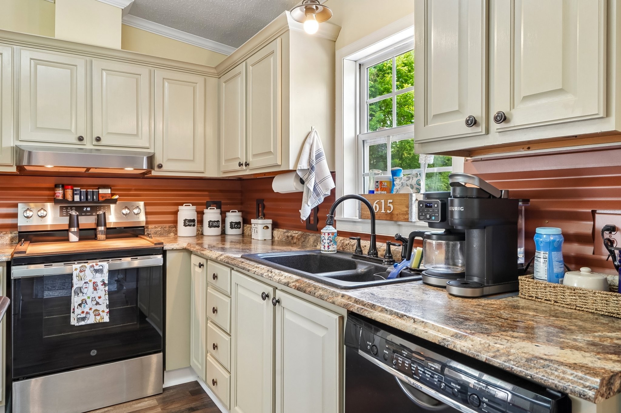 4844 Coleman Hill Road Rockvale, TN 37153 - Photo 17 of 66 a kitchen with stainless steel appliances granite countertop a sink a stove and a microwave