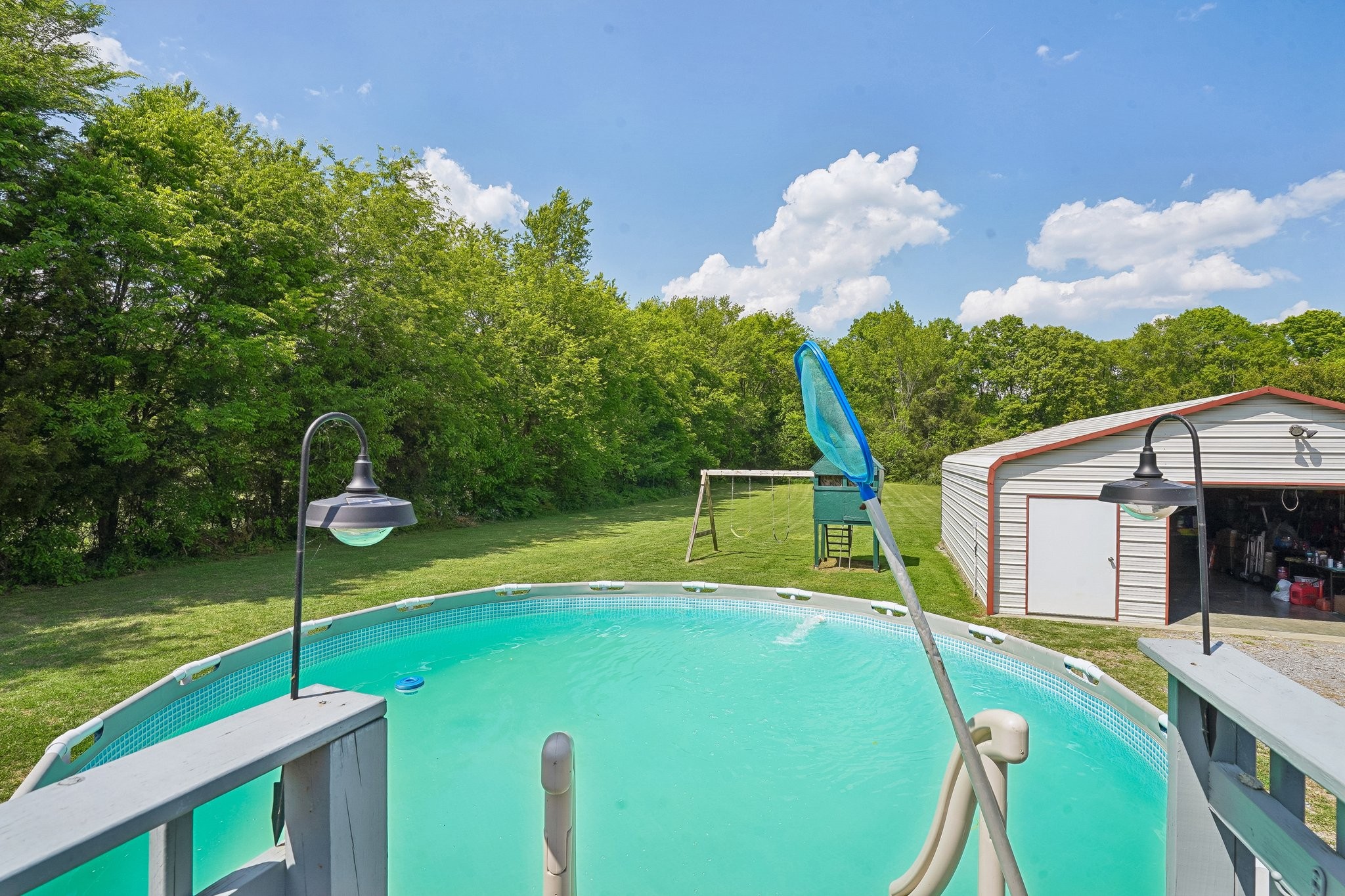 4844 Coleman Hill Road Rockvale, TN 37153 - Photo 39 of 66 a view of a house with swimming pool and a yard