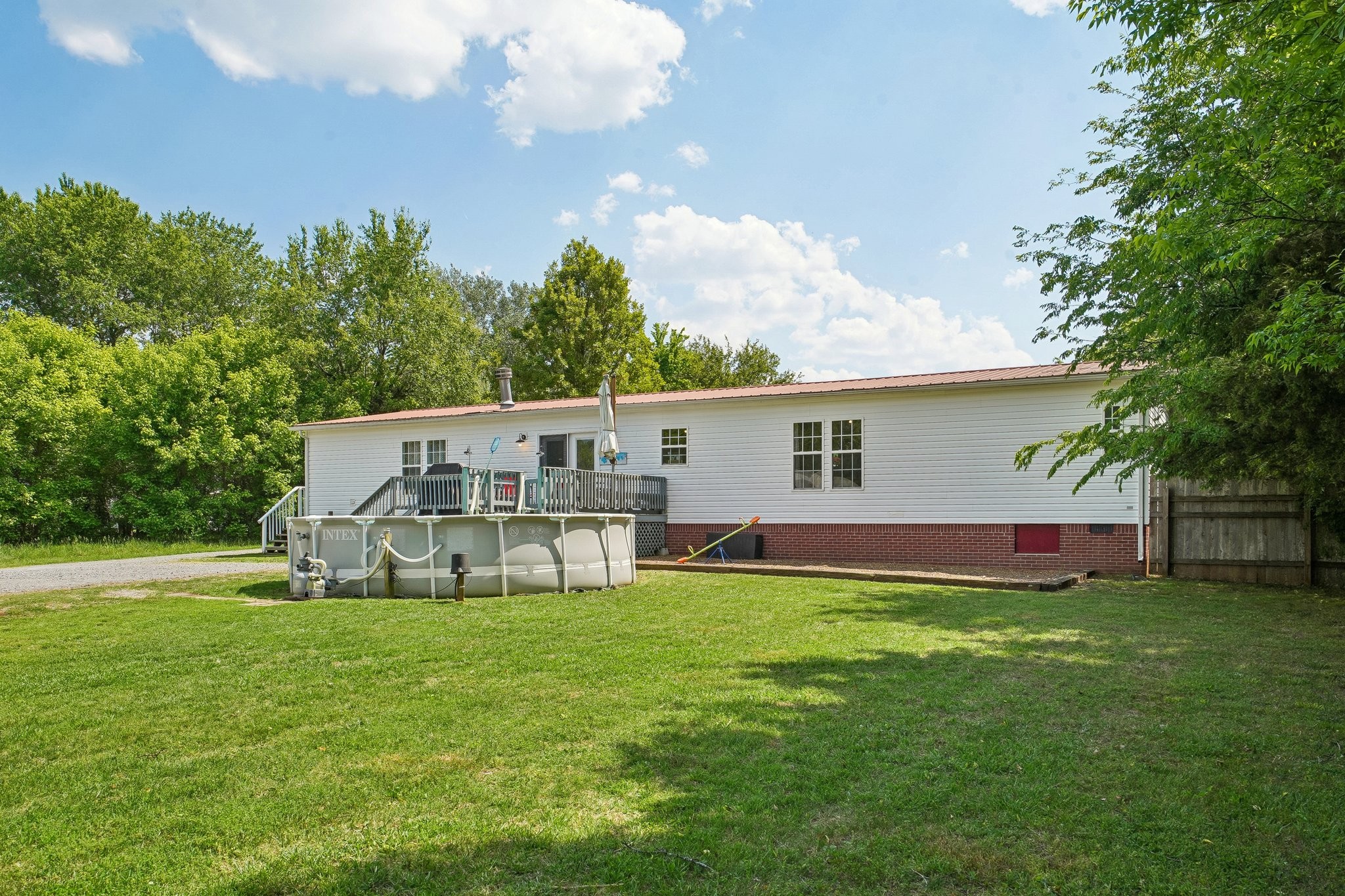 4844 Coleman Hill Road Rockvale, TN 37153 - Photo 47 of 66 a view of a house with a yard and sitting area