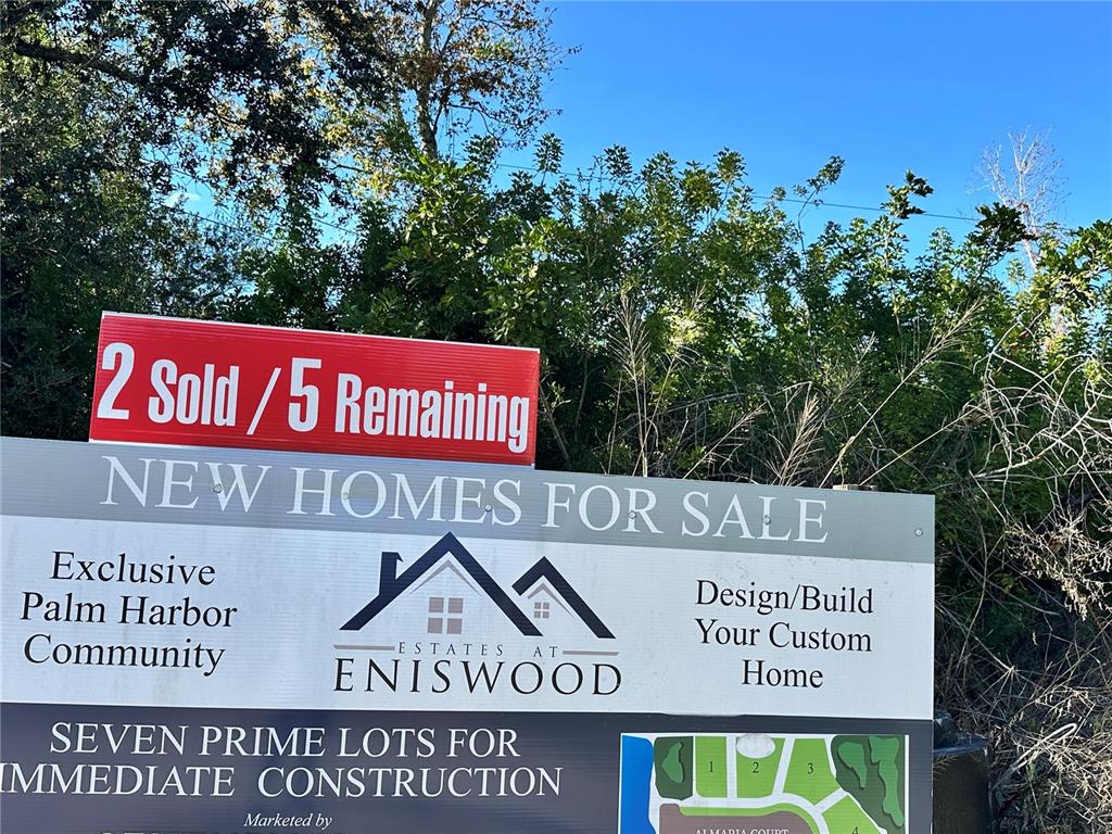 1289 Almaria Court Palm Harbor, FL 34683 - Photo 8 of 8 a sign on the side of a building