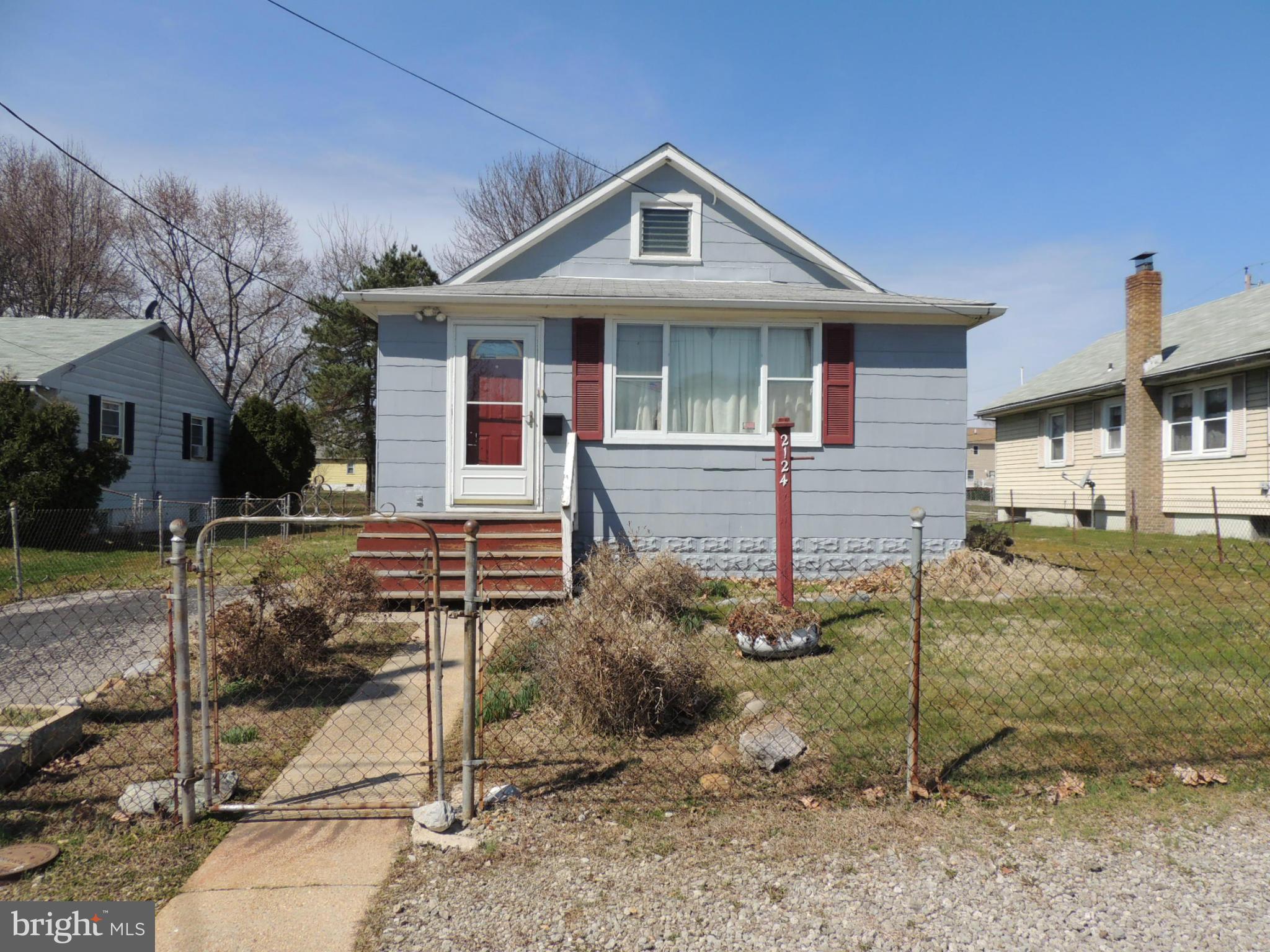 2124 Oak Road Baltimore, MD 21219 - Photo 2 of 20 a front view of a house with a yard