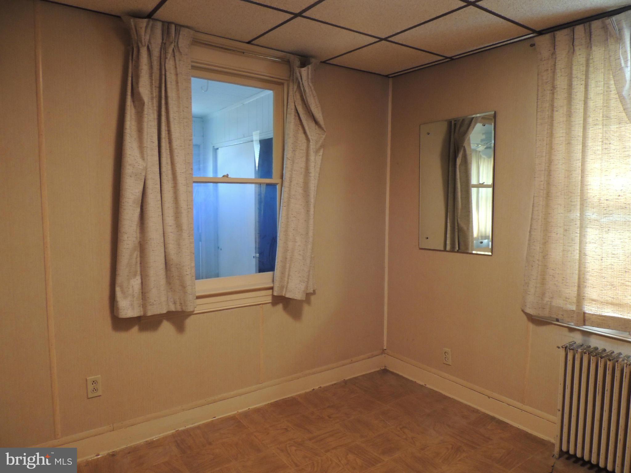 2124 Oak Road Baltimore, MD 21219 - Photo 11 of 20 an empty room with windows