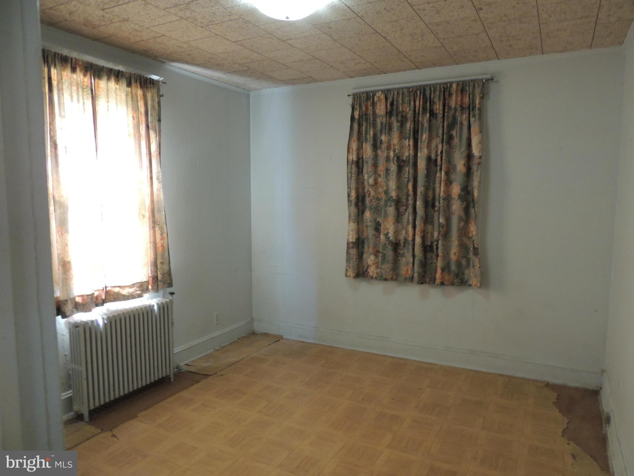 2124 Oak Road Baltimore, MD 21219 - Photo 13 of 20 a view of an empty room with a window