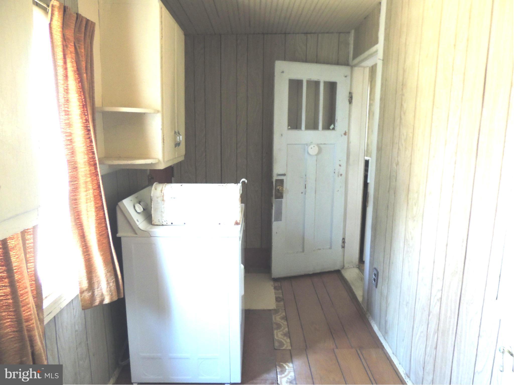 2124 Oak Road Baltimore, MD 21219 - Photo 18 of 20 a utility room with wooden floor washer and dryer