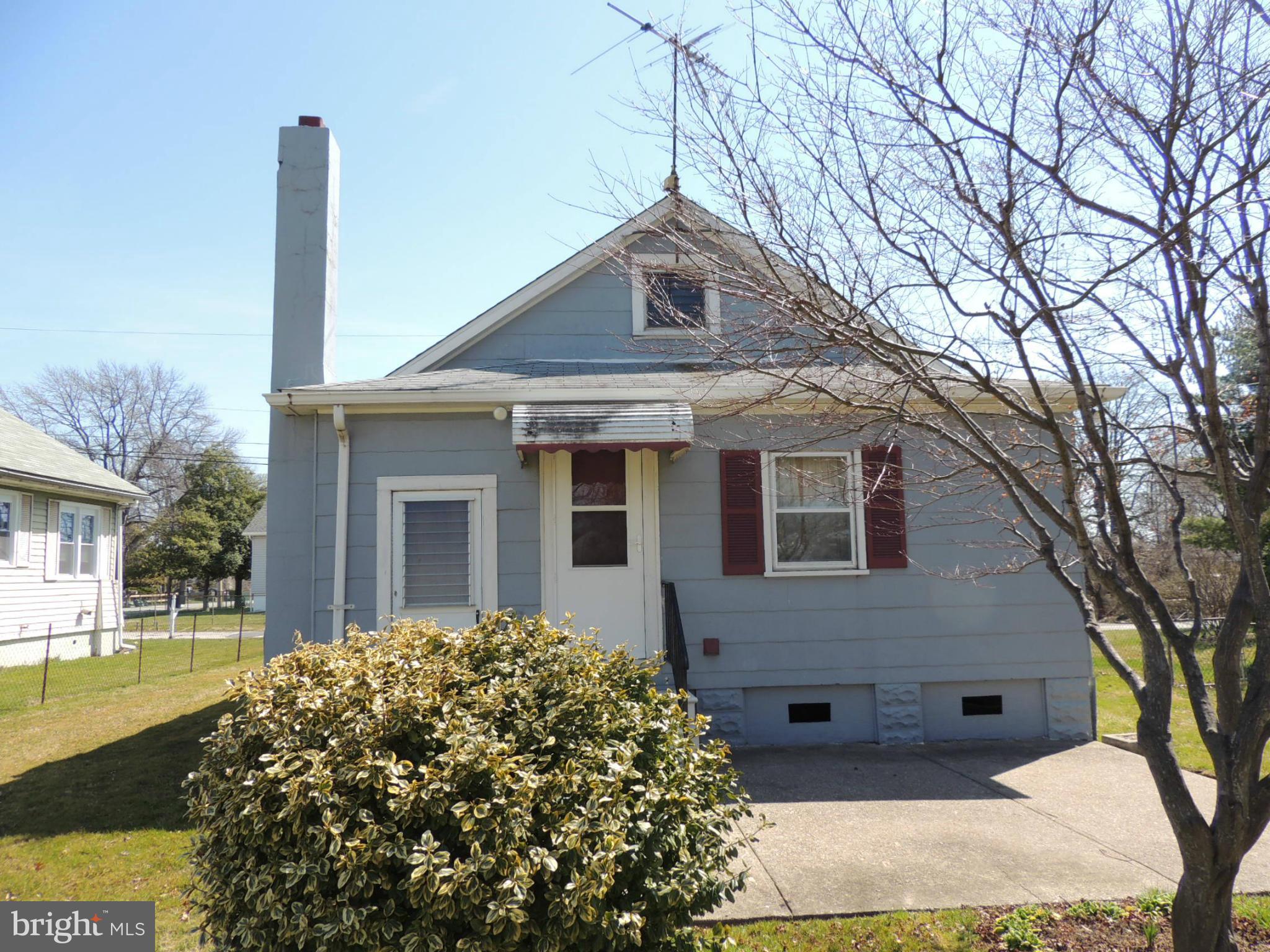 2124 Oak Road Baltimore, MD 21219 - Photo 5 of 20 a front view of a house with a garden