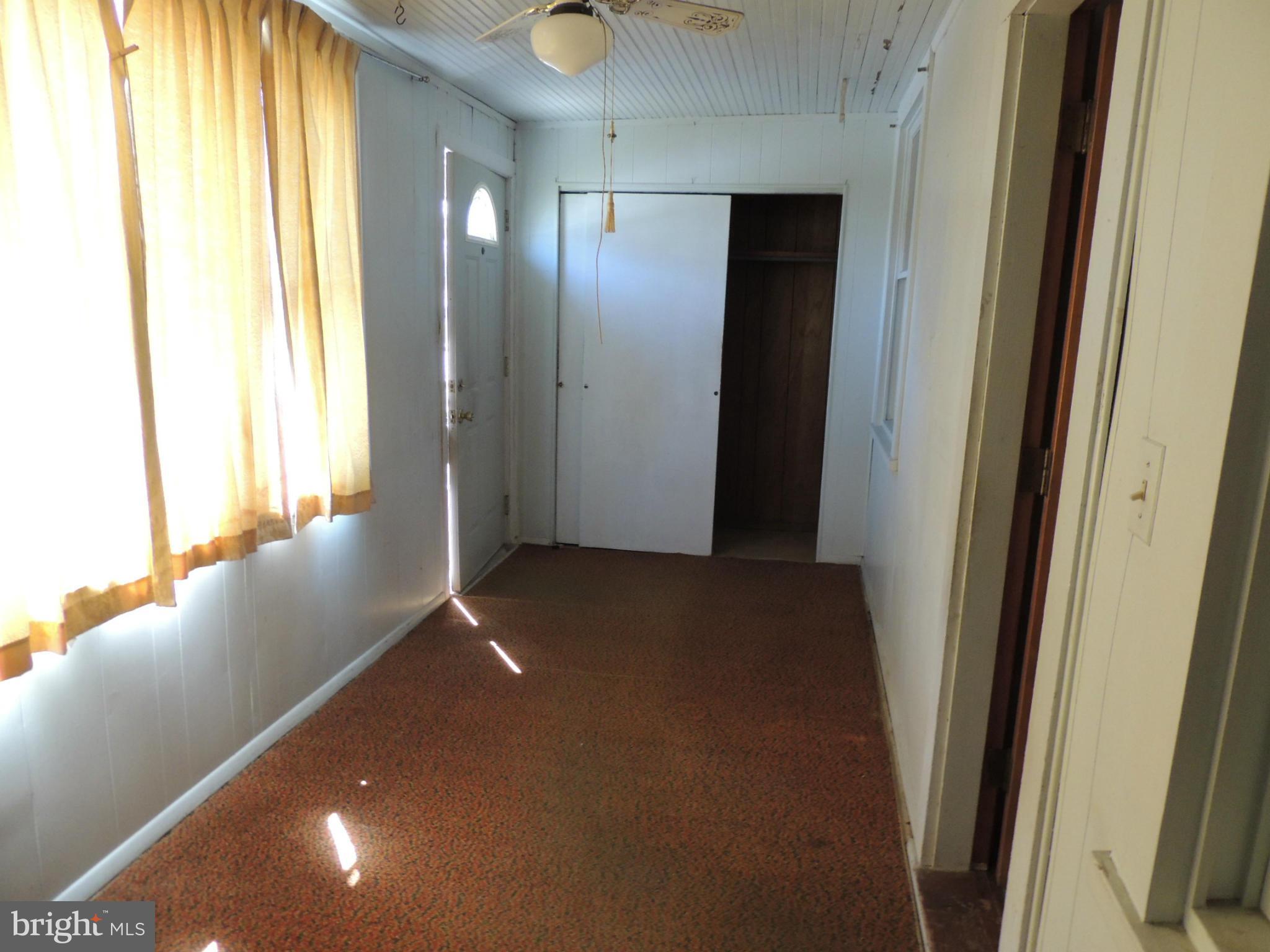 2124 Oak Road Baltimore, MD 21219 - Photo 8 of 20 a view of a hallway with windows