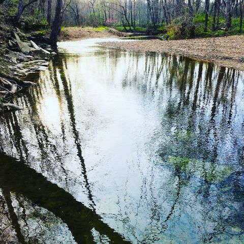 a view of wooden deck with lake view