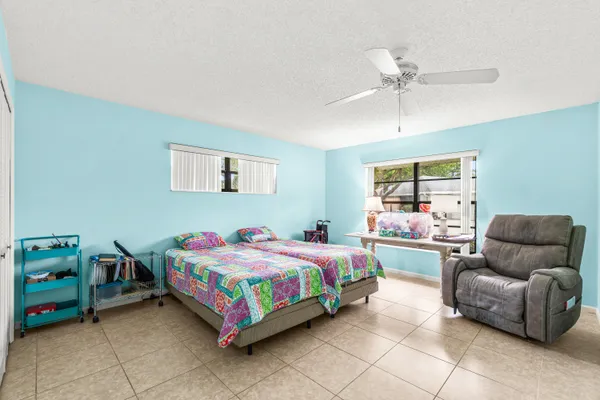 a bedroom with a bed and a couch
