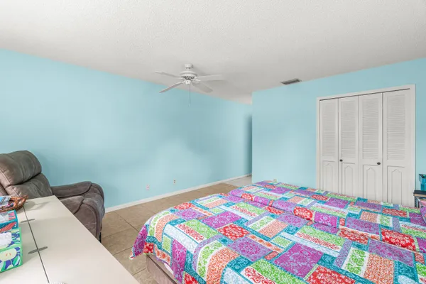 a bedroom with a bed and a lamp