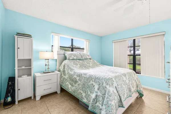 a bedroom with a large bed and a closet