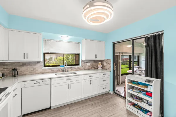 a kitchen with stainless steel appliances a sink and a stove
