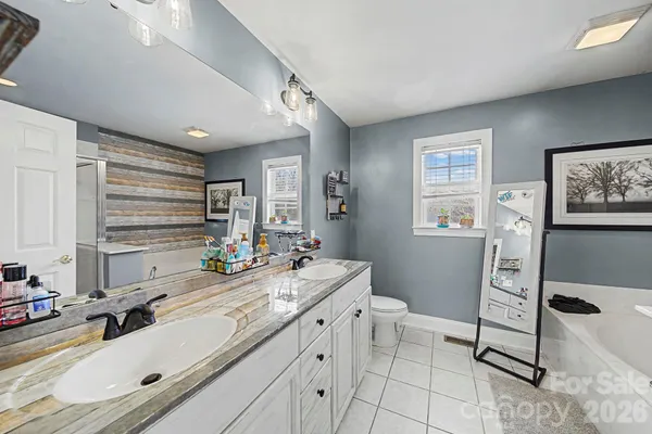 a bathroom with a shower and a tub