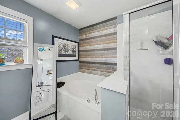 a en suite bathroom with a double vanity sink mirror and