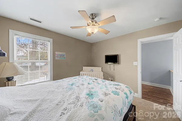 a bedroom with a bed and a table in it