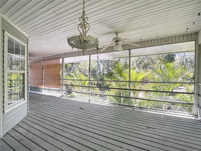 a view of an empty room with windows