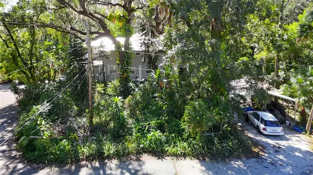 a view of house with backyard