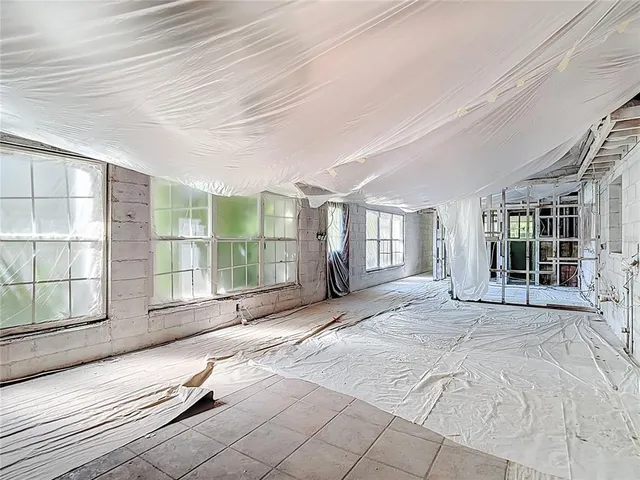 a aerial view of a house with a yard and fountain