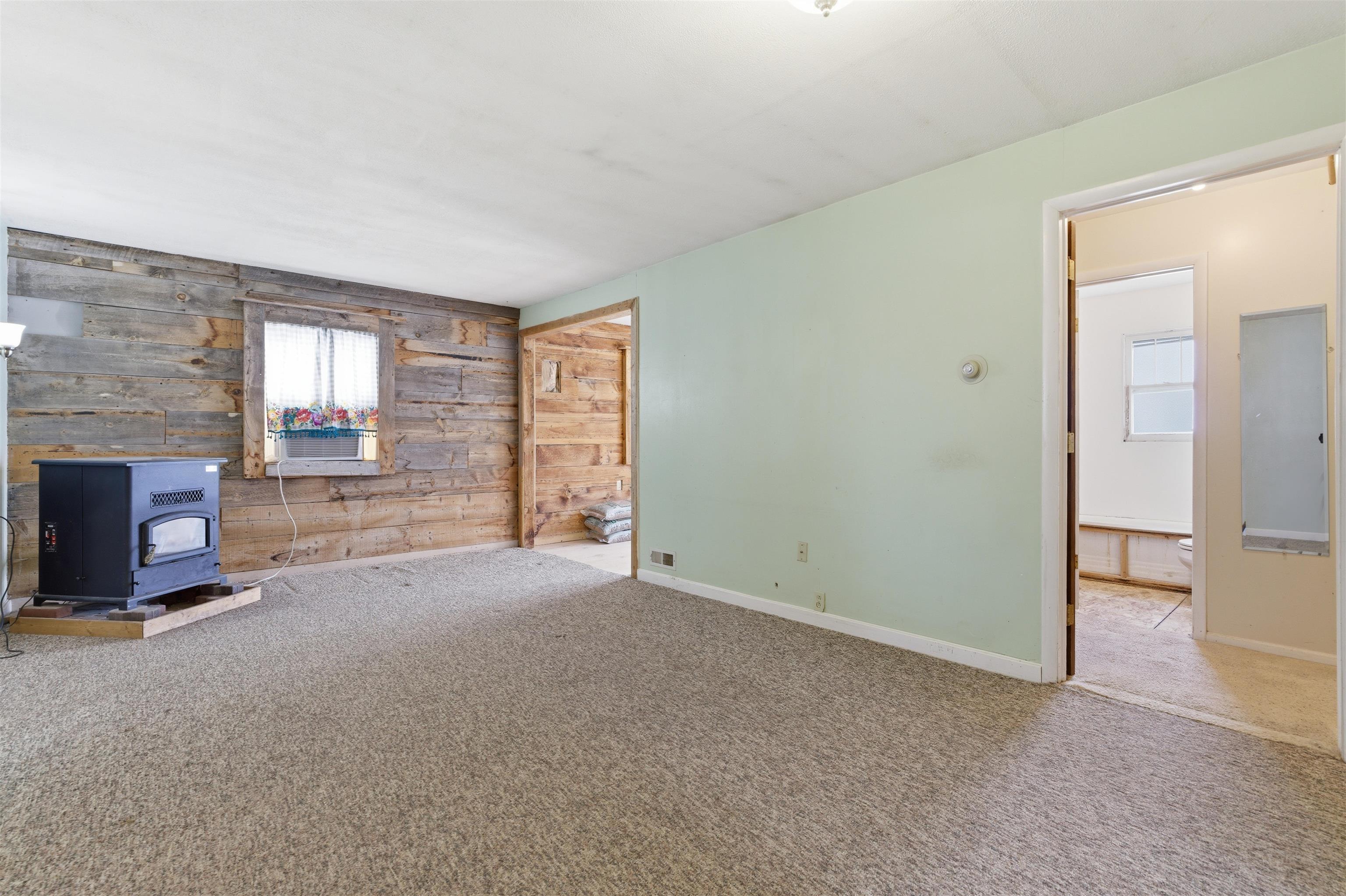 49091 KE Road Mesa, CO 81643 - Photo 13 of 29 an empty room with windows and fireplace