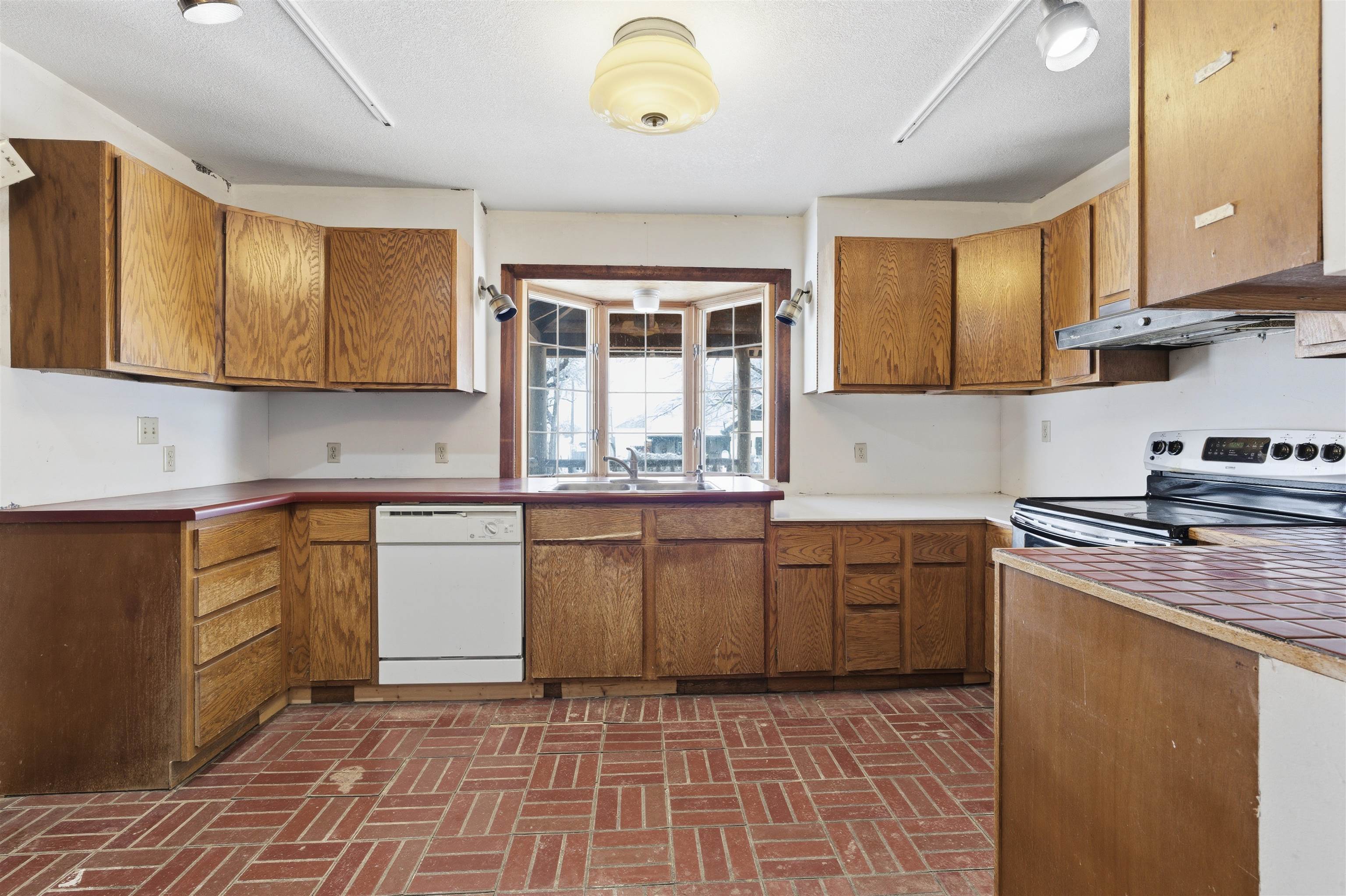 49091 KE Road Mesa, CO 81643 - Photo 23 of 29 a kitchen with stainless steel appliances granite countertop a stove a sink and a microwave