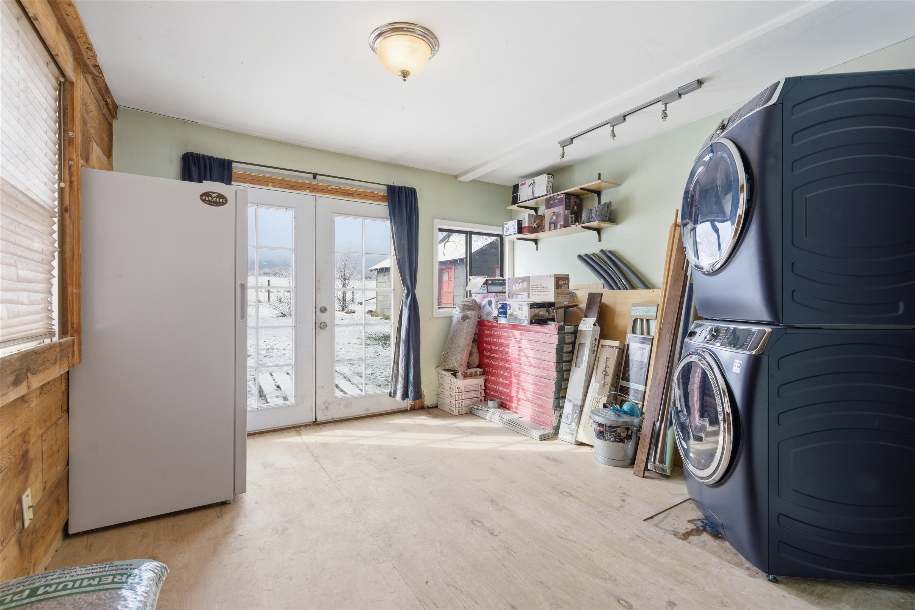 49091 KE Road Mesa, CO 81643 - Photo 26 of 29 a view of front door with washer and dryer