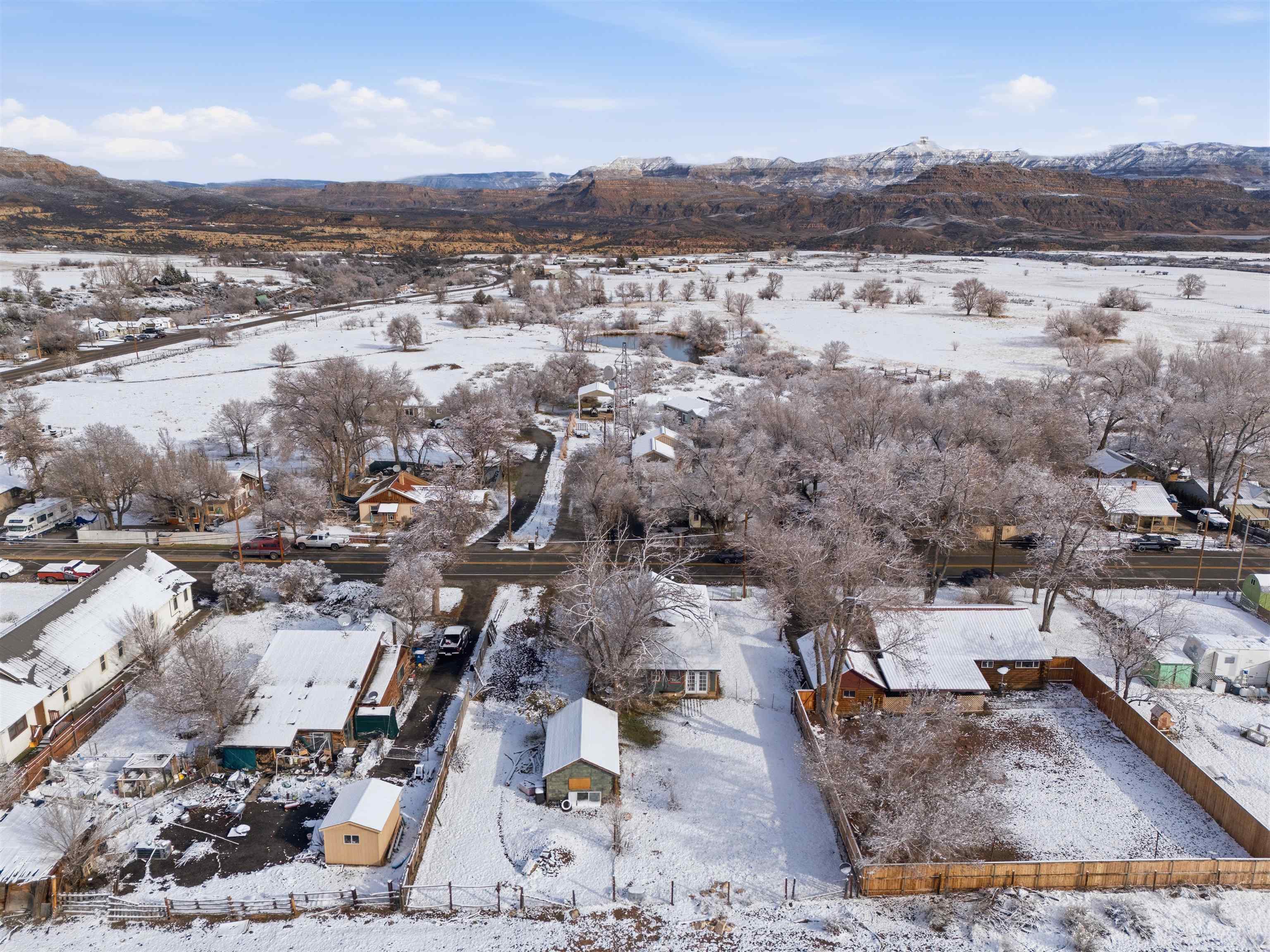 49091 KE Road Mesa, CO 81643 - Photo 8 of 29 an aerial view of residential house and lake