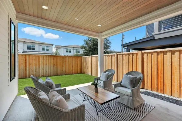 a view of backyard with seating space and furniture