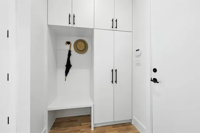 a kitchen with a sink stainless steel appliances and cabinets