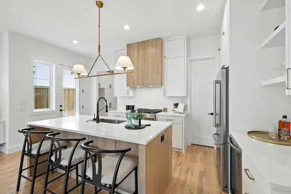 a kitchen with a counter space cabinets and appliances