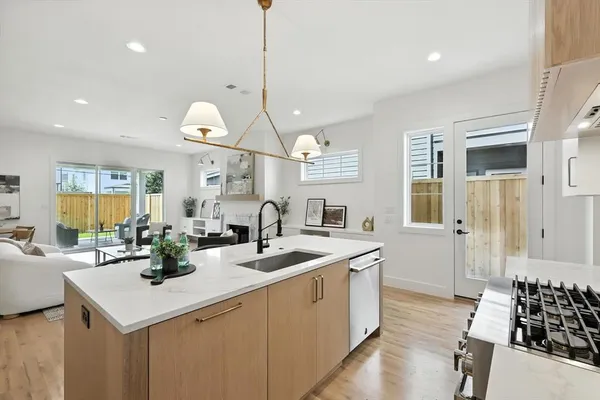 a bathroom with a sink and a picture of a shower
