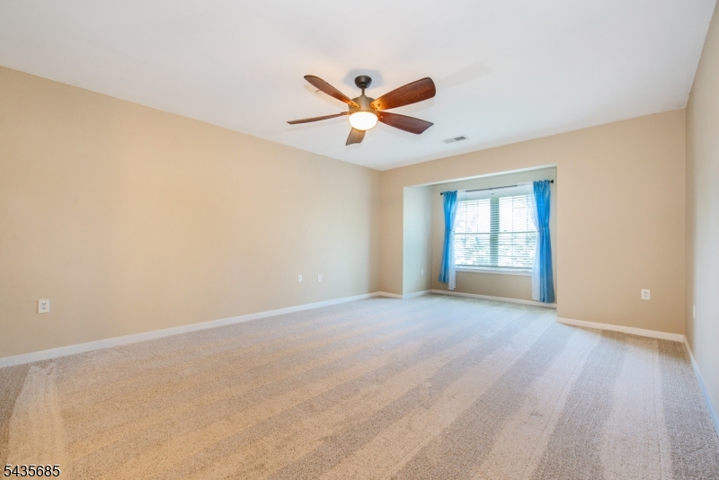 16 Main Street Sparta, NJ 07871 - Photo 24 of 33 an empty room with windows and fan