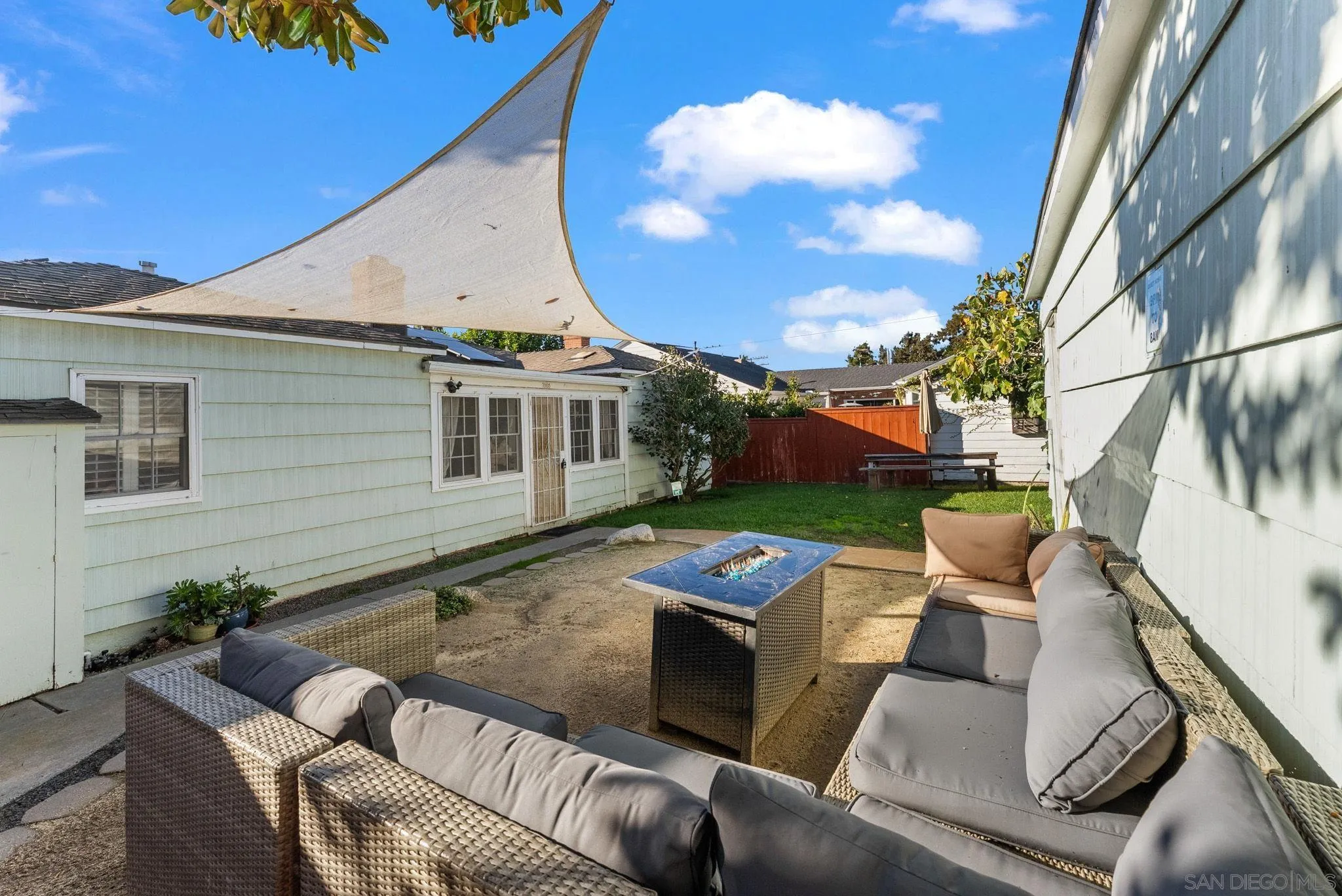 7005 Draper Avenue La Jolla, CA 92037 - Photo 17 of 26 a view of a patio with couches table and chairs and potted plants